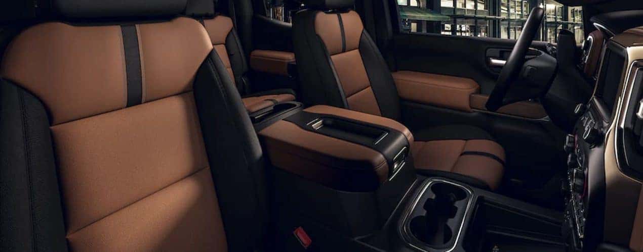The black and brown interior of a 2022 Chevy Silverado 1500 is shown during a 2022 Chevy Silverado 1500 vs 2022 Ram 1500 comparison.