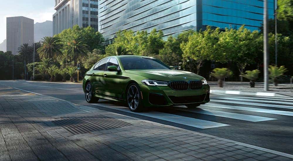 A green 2022 BMW 5-Series is shown after looking at used cars in Cincinnati, Ohio.