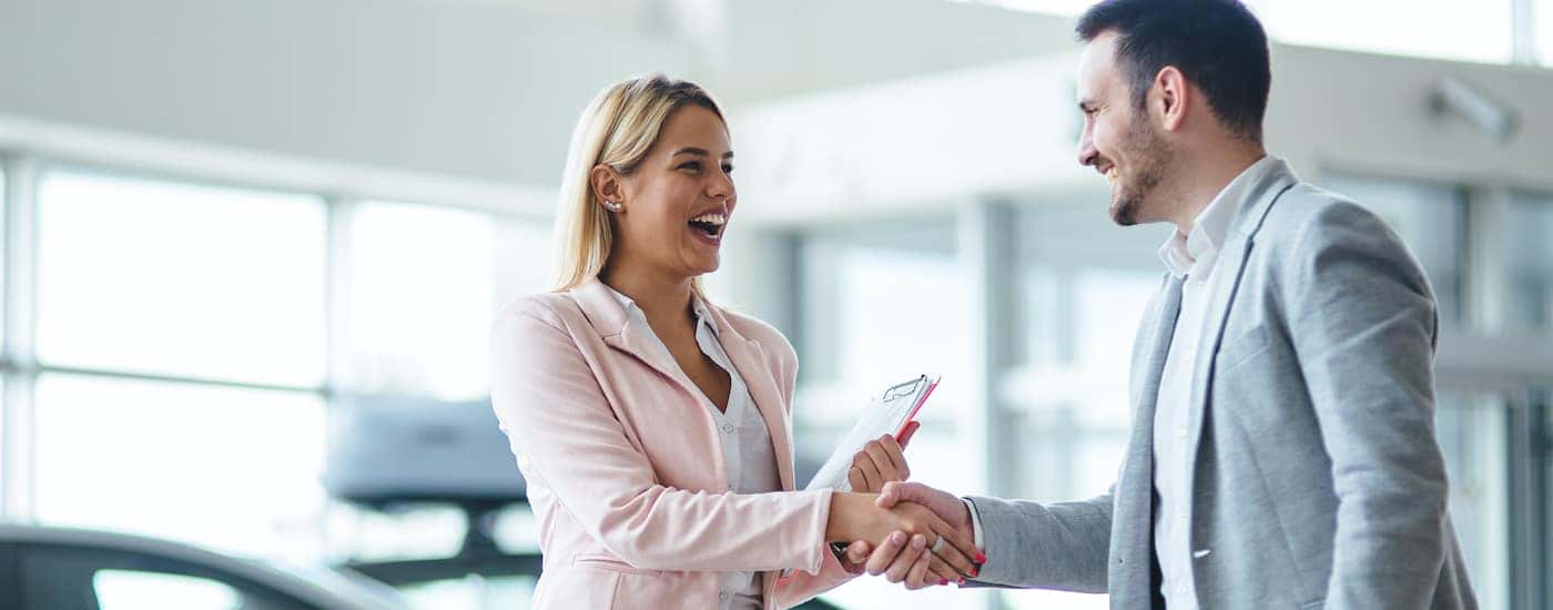 A salesperson is shown talking to a customer about Chevrolet in Cincinnati, OH.