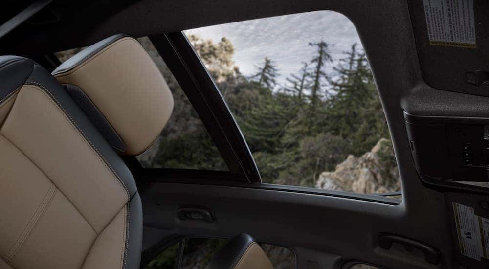 The moonroof is shown in a 2022 Chevy Equinox Premier.
