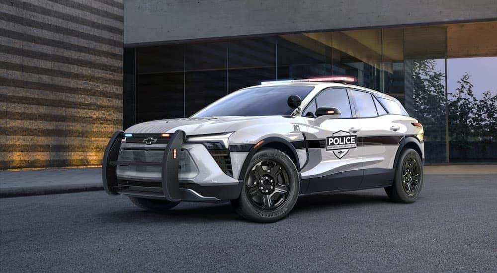 A white 2024 Chevy Blazer EV Police Cruiser is shown angled left after leaving a Chevrolet dealership.