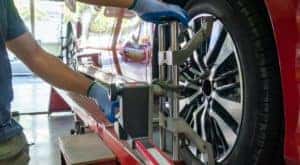 A mechanic is shown performing an alignment at a tire shop near you.