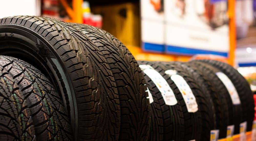 A rack full of tires is shown at an all season tire dealer.