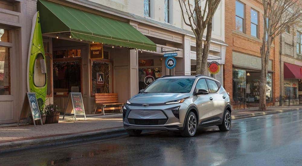 A silver 2022 Chevy Bolt EUV is shown on the side of a city street.