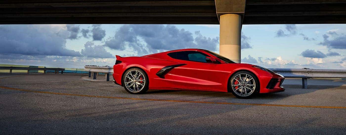 A red 2023 Chevrolet Corvette 3LT is shown near an overpass after leaving a Cincinnati Chevrolet dealer.