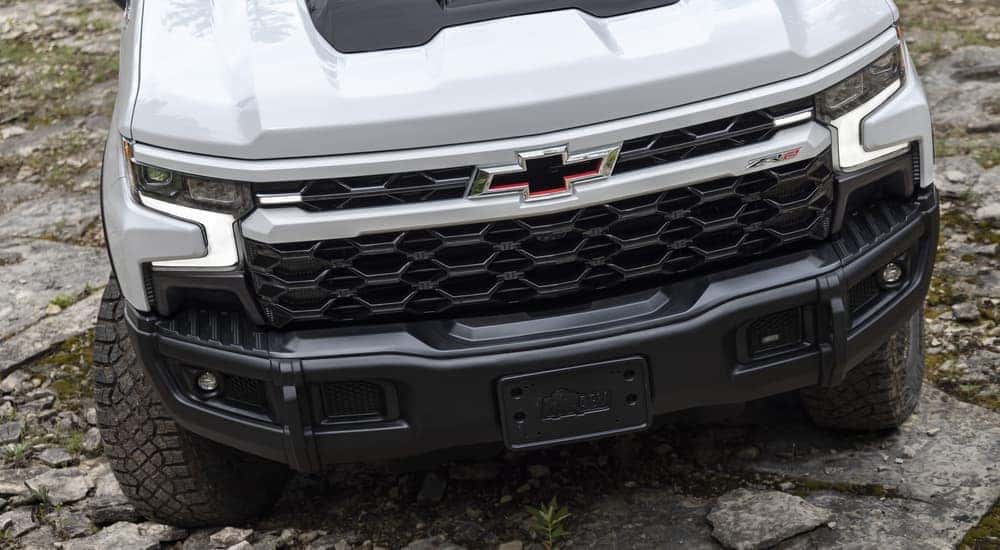 A white 2023 Chevy Silverado ZR2 Bison is shown off-roading.