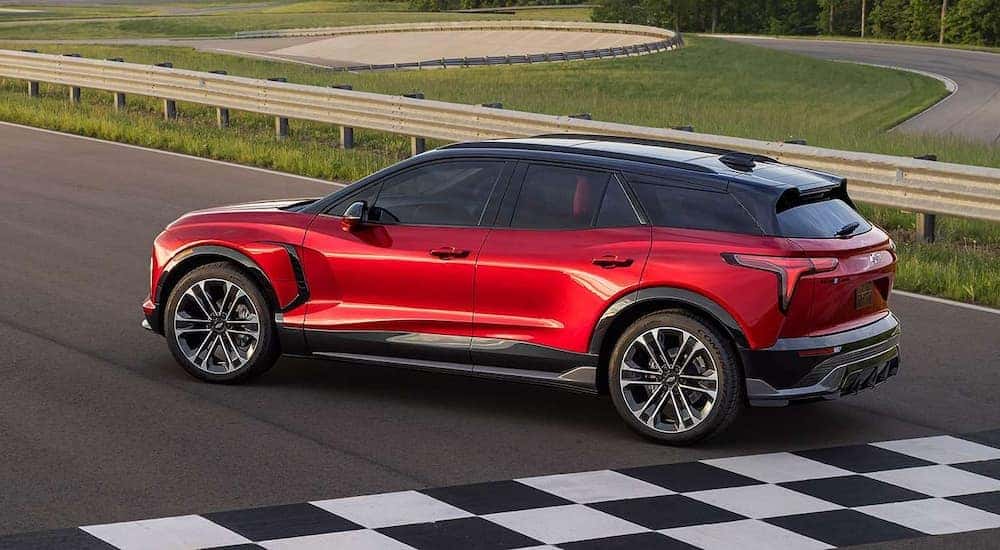 A red 2024 Chevy Blazer EV is shown on a track after leaving a Cincinnati Chevrolet dealer.