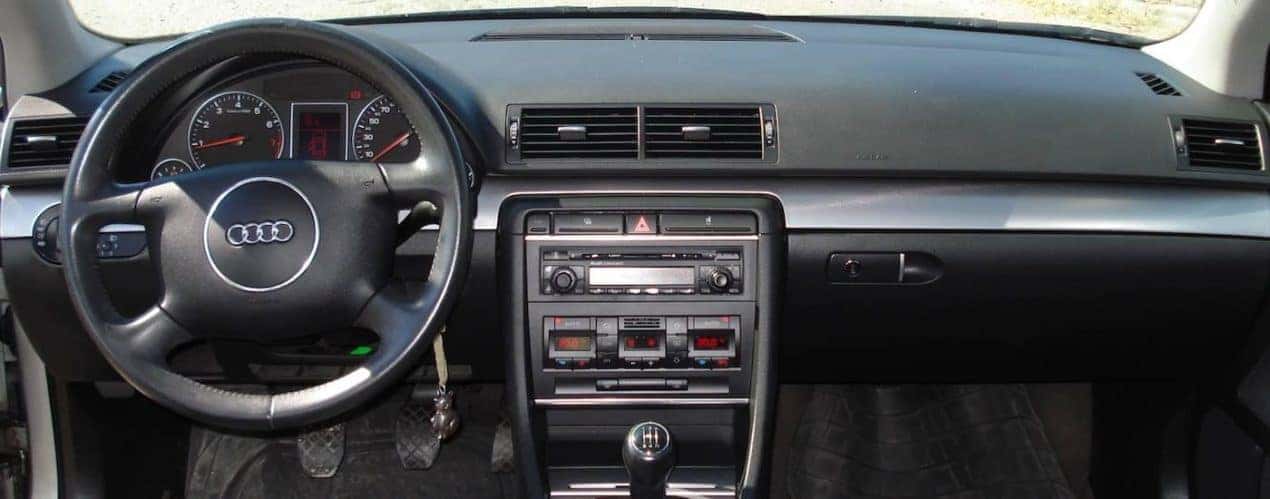 The black interior is shown in a 2002 used Audi A4.