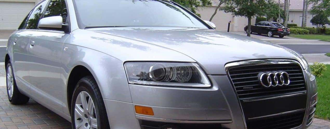 A silver 2005 used Audi A4 is shown from the front in a driveway.