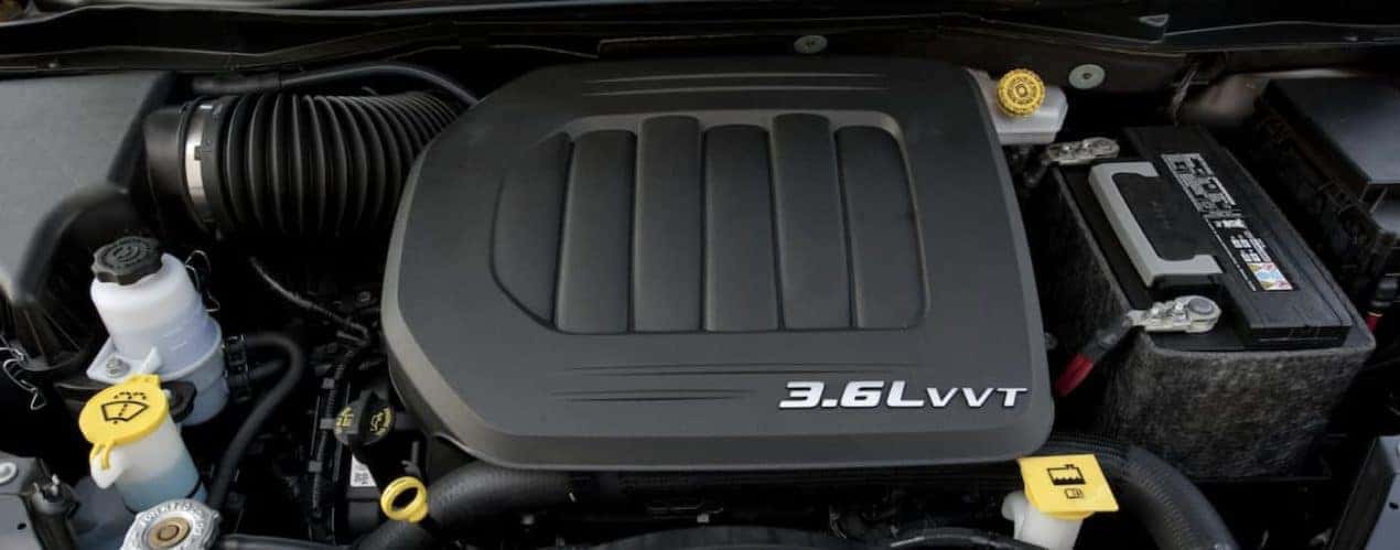 The black interior of a 2014 Used Chrysler Town & Country 3.6L VVT Engine is shown.
