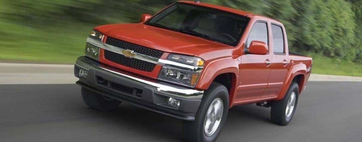 A red 2010 Chevy Colorado is shown from the front at an angle.