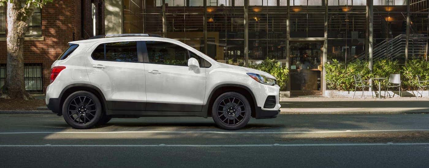 A white 2022 Chevy Trax is shown from the side after leaving a Chevy SUV dealer.