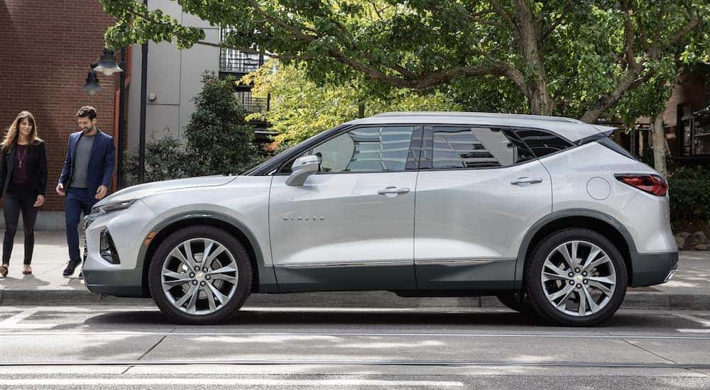 A popular used Chevy Blazer for sale, a silver 2022 Chevy Blazer, is shown from the side.