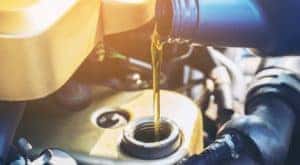 Oil is shown flowing into a tank.