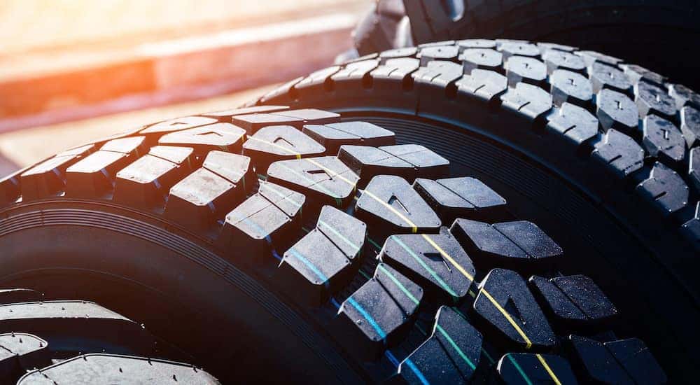 Two tires are shown in close up after searching 'performance tires near you.'
