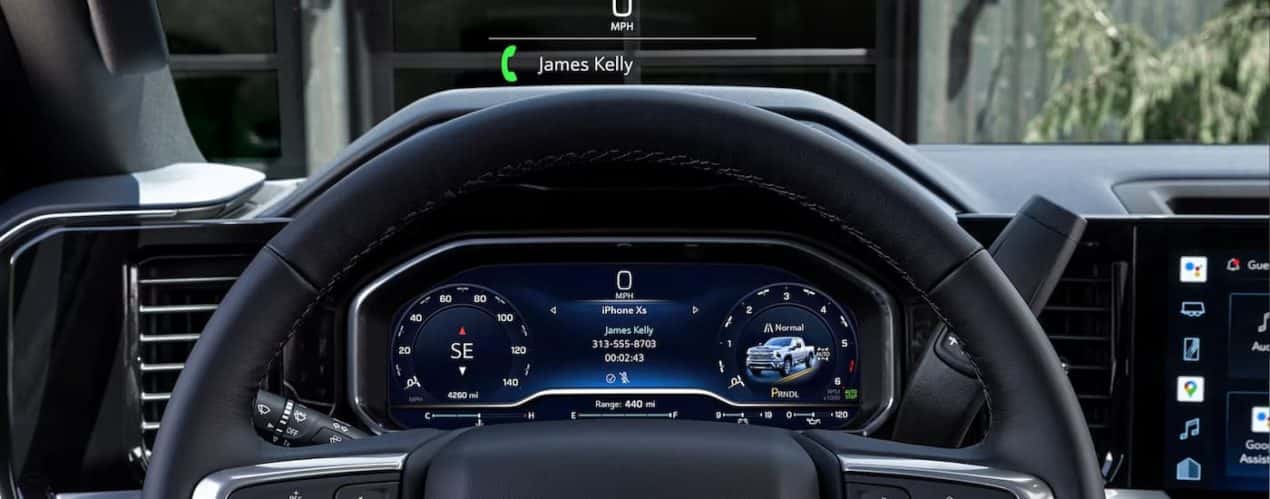 A close up of the steering wheel of a 2024 Chevy Silverado 2500 HD is shown.