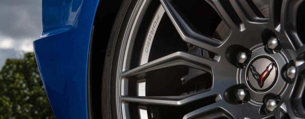 A close up shows the forged rim on a blue 2023 Chevy Corvette Stingray Z06.