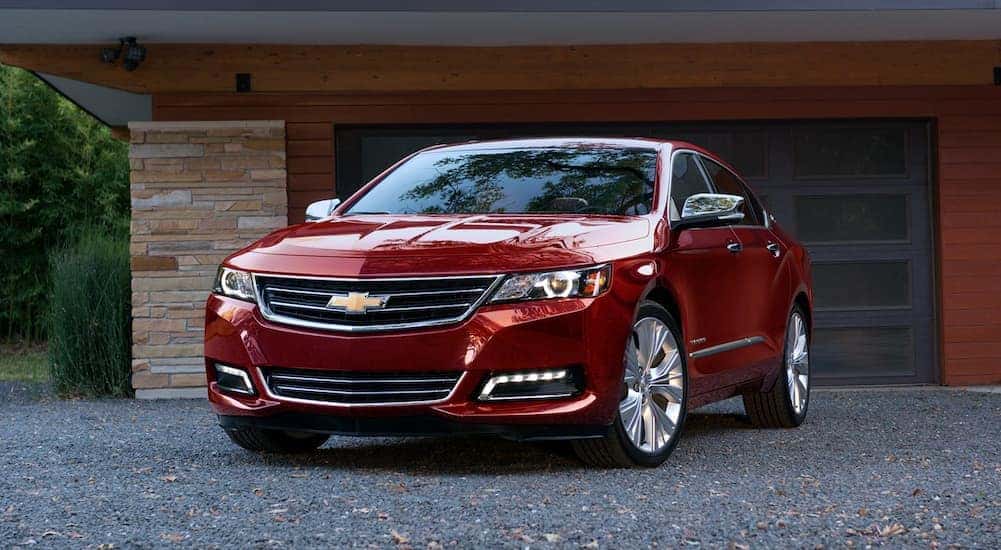A red 2020 Chevy Impala is shown from the front at an angle.
