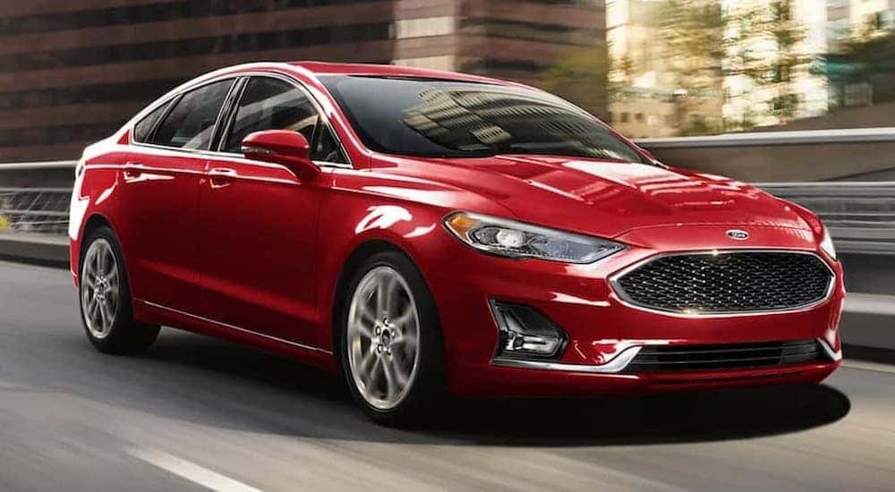 A red 2020 Ford Fusion is shown from the front at an angle.