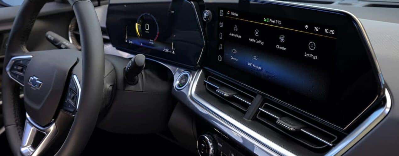 A close up of the dashboard of a 2024 Chevy Trax is shown during a 2024 Chevy Trax vs 2024 Dodge Hornet comparison.