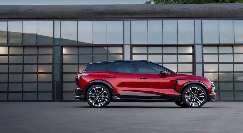 A red 2024 Chevy Blazer EV SS is shown parked outside a building.