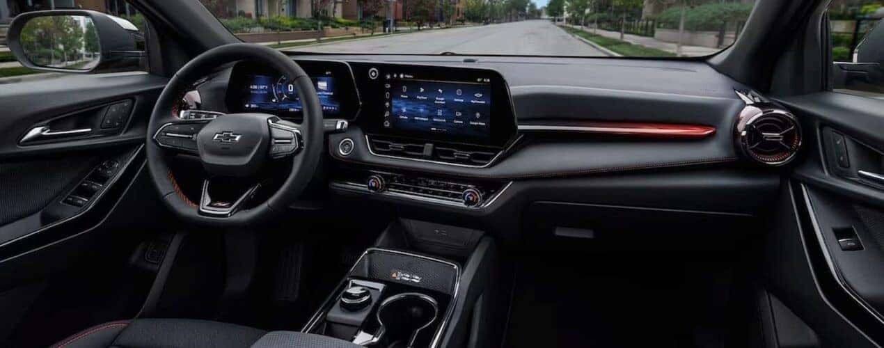 The black interior and dash in a 2025 Chevy Equinox is shown.