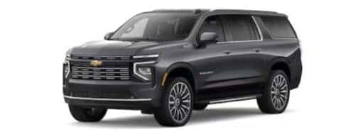 A black 2025 Chevy Suburban angled left.