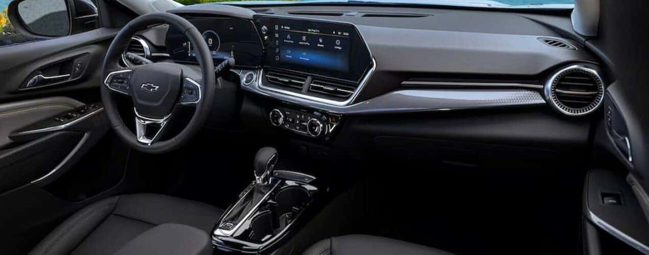 The black interior and dash in a 2024 Chevy Trax is shown.