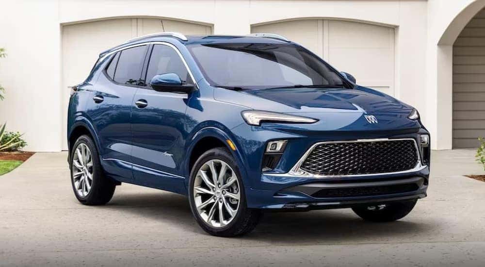 A blue 2024 Buick Encore GX Avenir is shown parked after visiting a Buick service center.