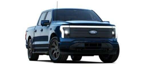 A blue 2024 Ford F-150 Lightning is angled right.