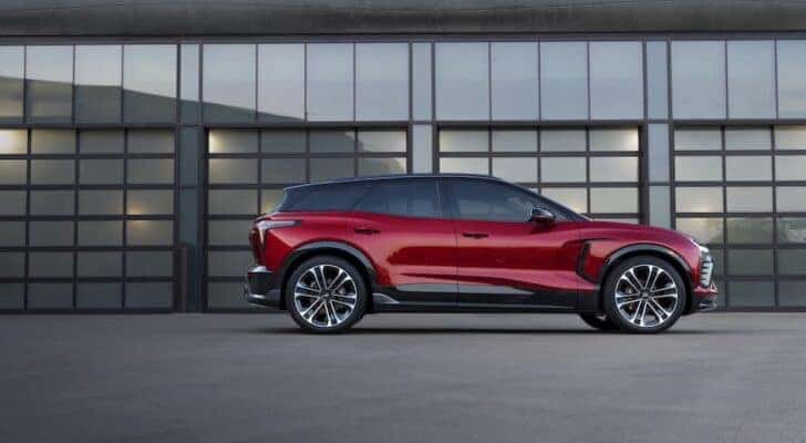 A red 2024 Chevy Blazer EV RS is shown from the side.