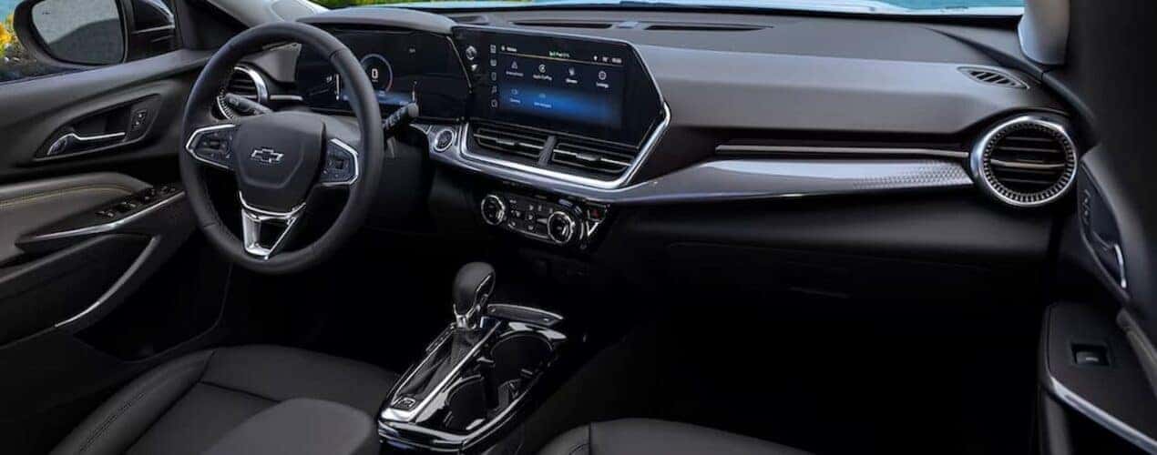 The black interior and dash in a 2025 Chevy Trax is shown.