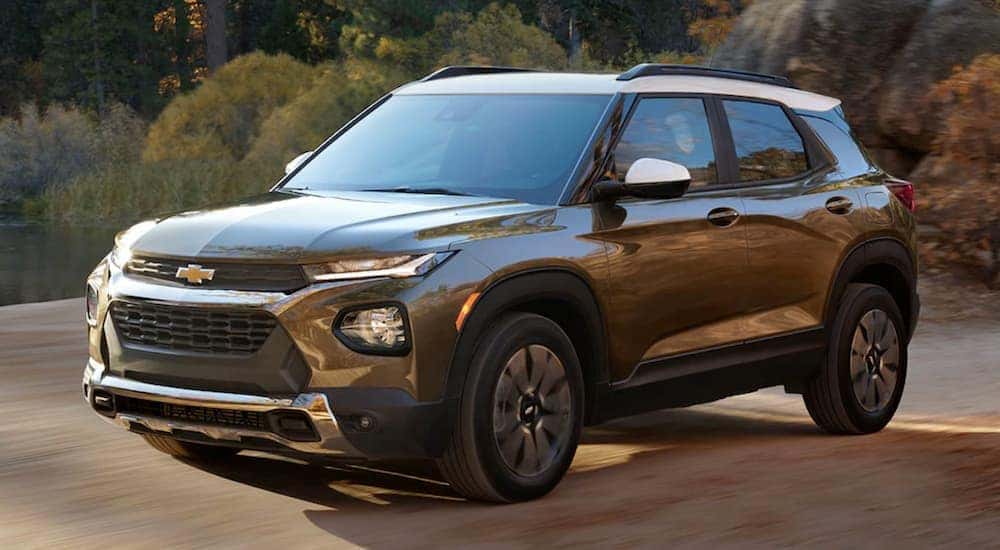 A brown 2021 Chevy Trailblazer ACTIV driving on a road.