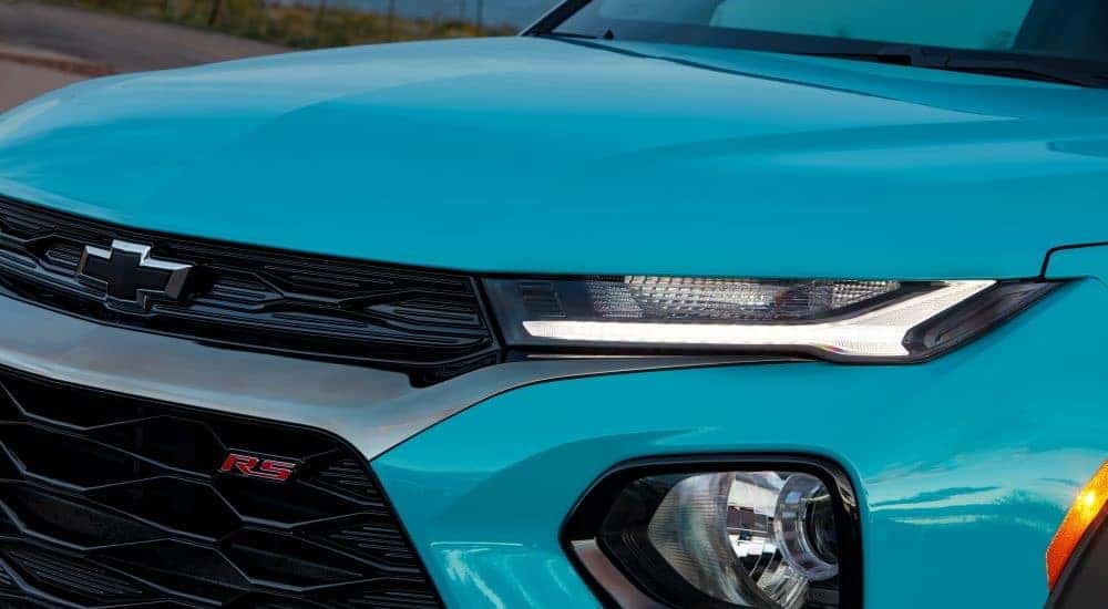 Close-up of the headlight on a teal 2021 Chevy Trailblazer RS.