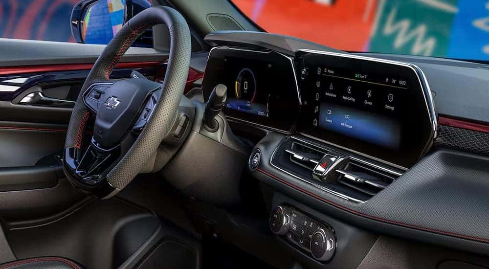 The steering wheel and infotainment screen in the cabin of a 2024 Chevy Trailblazer RS.