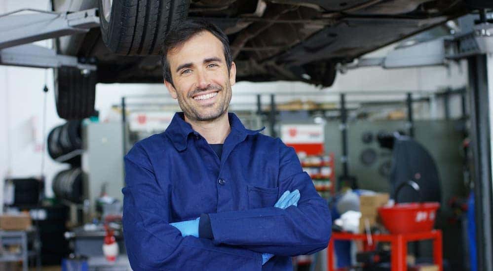 A technician is shown smiling at a Buick service center in Cincinnati .