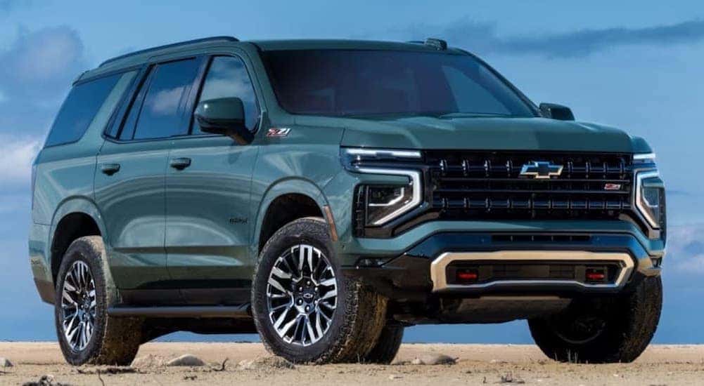 A green 2025 Chevy Tahoe Z71 parked and angled right.