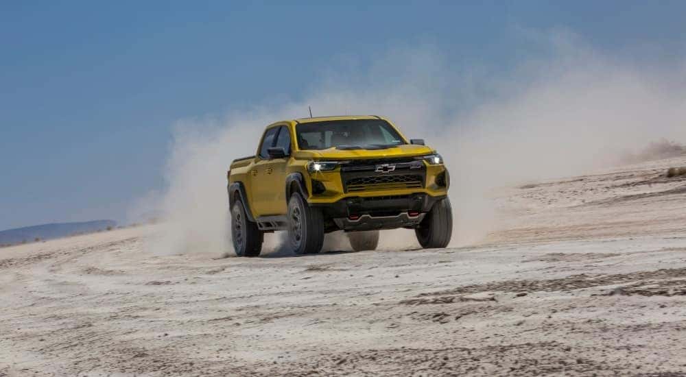 A yellow 2024 Chevy Colorado ZR2 is shown from the front at an angle.