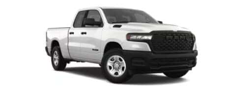 A white 2025 Ram 1500 Tradesman is angled right.