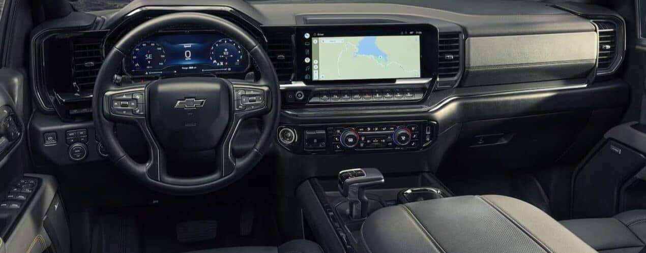 The black and gray interior and dash are shown in a 2025 Chevy Silverado 1500.