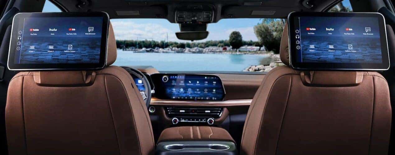 The black and brown interior and dash are shown in a 2025 Chevy Suburban.