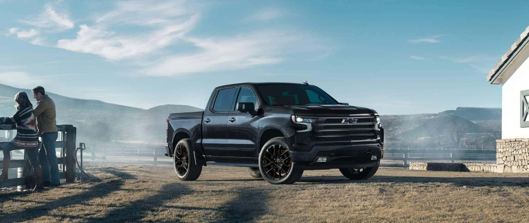 A black 2025 Chevy Silverado 1500 High County parked on a ranch.