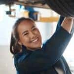 A technician is shown performing a commercial truck service.