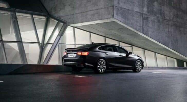 A 2024 Chevy Malibu Midnight Edition is shown parked after viewing used cars for sale near Florence.