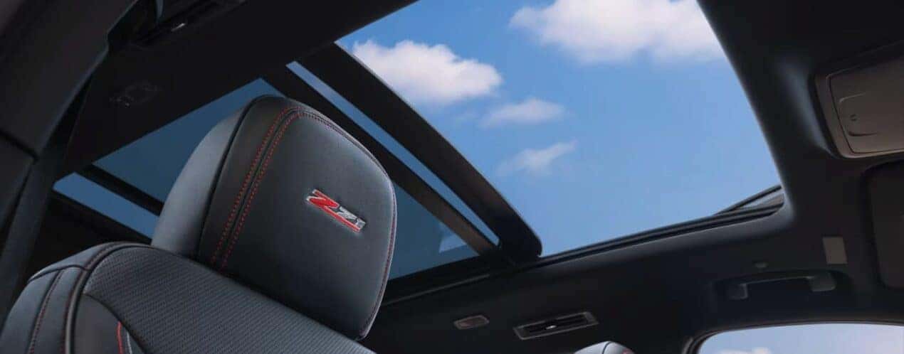A close-up of a headrest and sunroof are shown in a 2025 Chevy Traverse Z71.