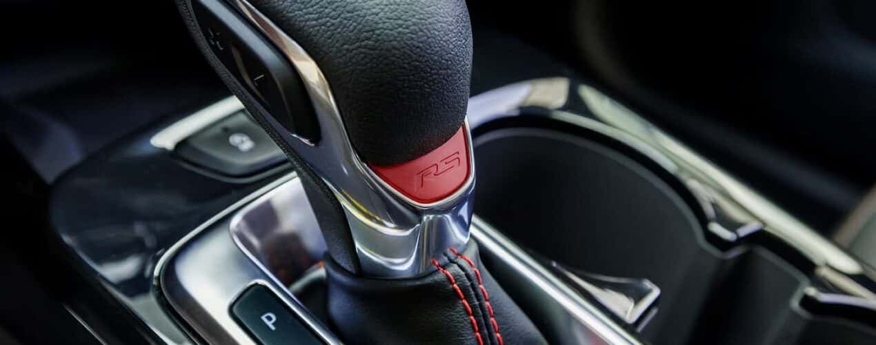 A close-up of the shifter is shown in a 2025 Chevy Trax 2RS.