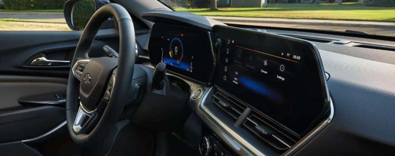 The close-up of the black dash is shown in a 2025 Chevy Trax LT.
