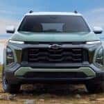 Front angle view of a green 2025 Chevy Equinox.