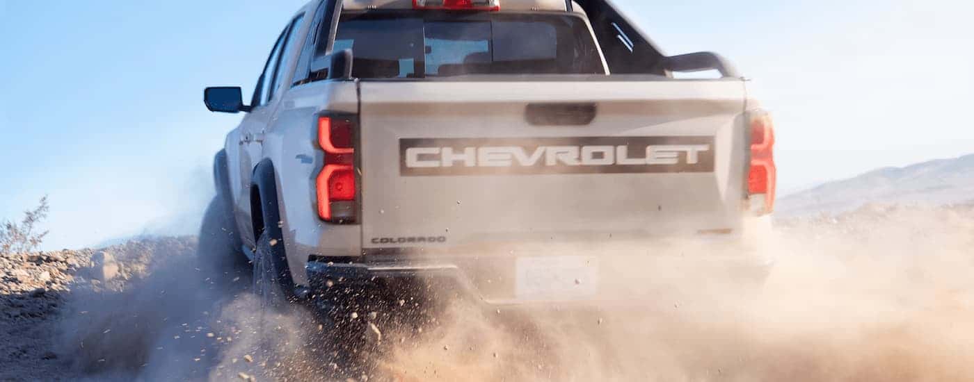 Grey 2025 Chevy Colorado ZR2 Bison off-roading on a dusty trail.