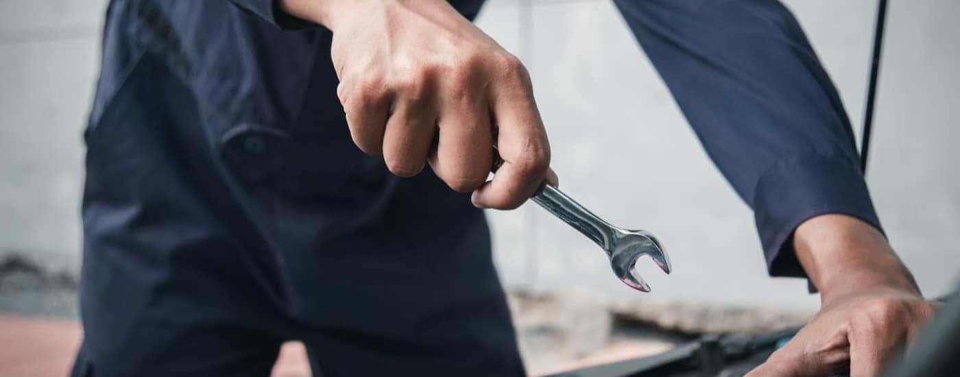 A mechanic working on a vehicle.